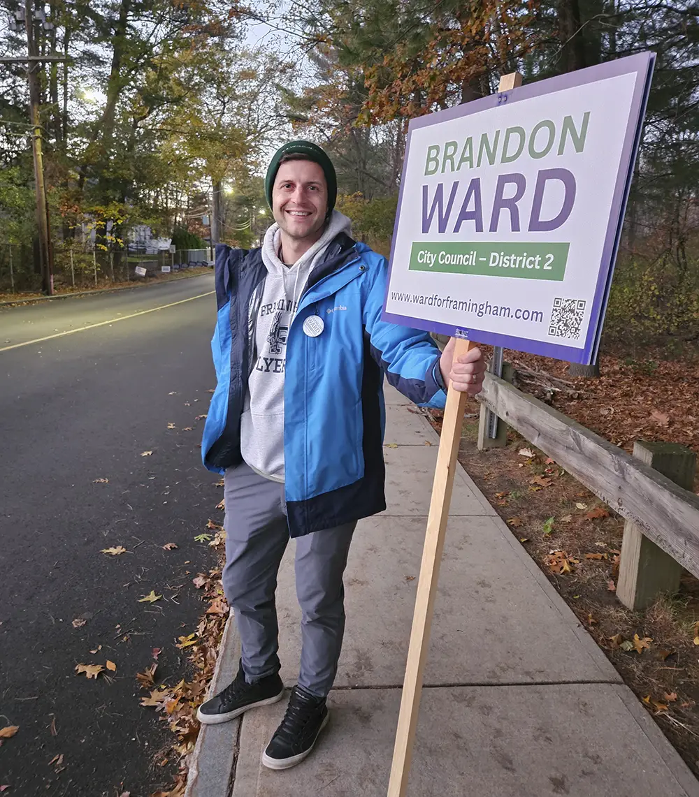 Brandon Ward holding an election sign